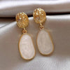 Oval Hanging Earrings with 18K gold plating and white enamel