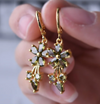 18 Karat Gold Plated hoop earrings with green crystal daisies