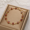 Red 18 Karat Gold Plated bracelet against the evil eye