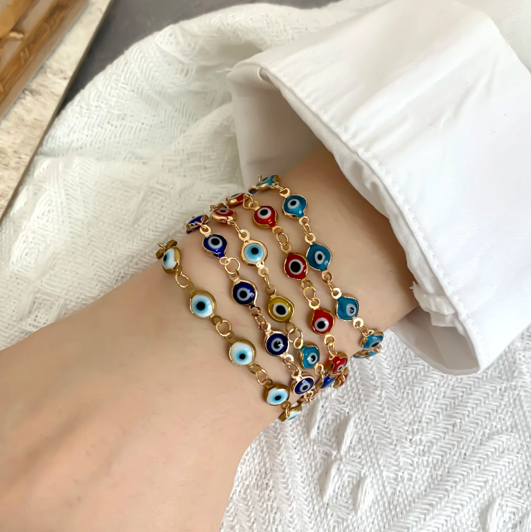 Red 18 Karat Gold Plated bracelet against the evil eye