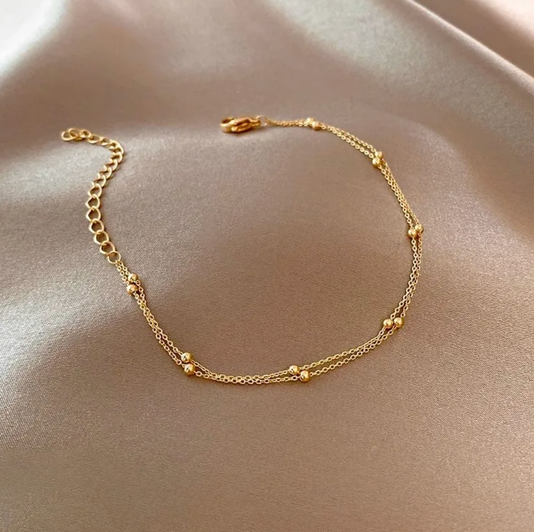 Very fine double 18 Karat Gold Plated bracelet with beads