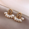 Handmade earrings made of natural pearls with 6 pearls